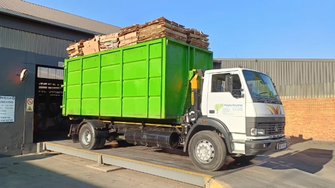 Phepha Recycling truck carrying a full load of paper collected for recycling